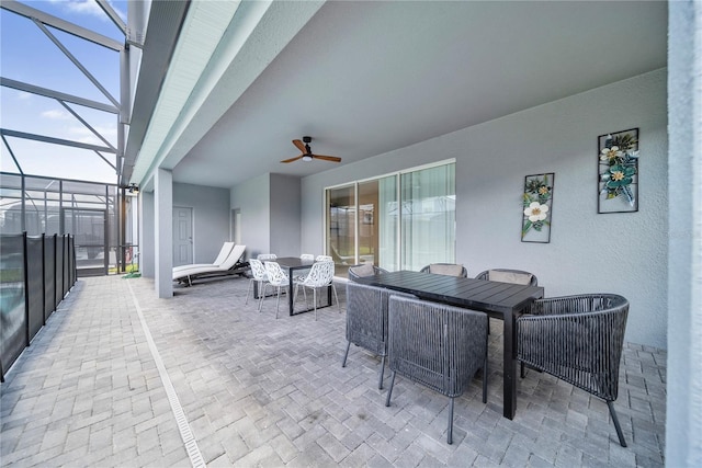 4149 Lana Ave, Davenport, FL 33897 - view of patio / terrace with outdoor dining space, a ceiling fan, and glass enclosure