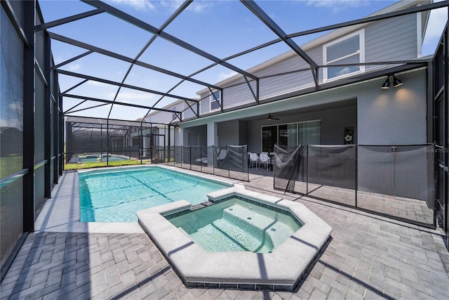 4149 Lana Ave, Davenport, FL 33897 - view of pool featuring a patio area, ceiling fan, a pool with connected hot tub, and glass enclosure