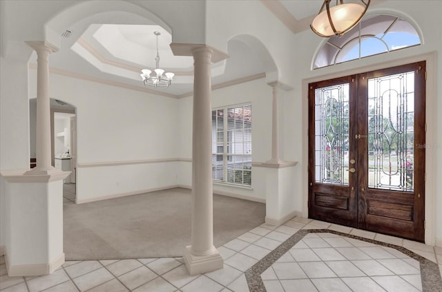 10616 Emerald Chase Dr, Orlando, FL 32836 - entryway with baseboards, a raised ceiling, ornamental molding, french doors, and ornate columns