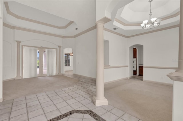 10616 Emerald Chase Dr, Orlando, FL 32836 - empty room featuring ornate columns, a tray ceiling, and light colored carpet