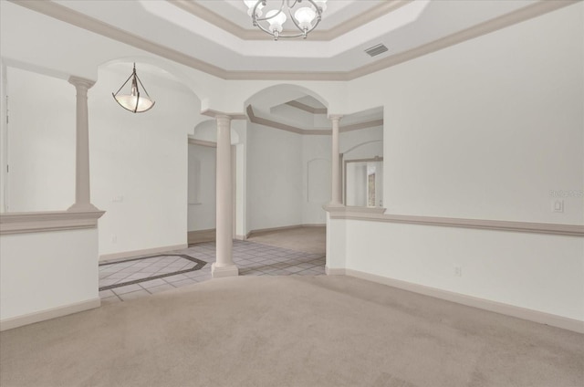 10616 Emerald Chase Dr, Orlando, FL 32836 - spare room with arched walkways, a raised ceiling, light colored carpet, and ornate columns