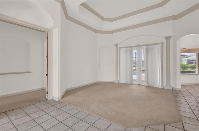 10616 Emerald Chase Dr, Orlando, FL 32836 - empty room with light colored carpet, baseboards, french doors, ornamental molding, and ornate columns