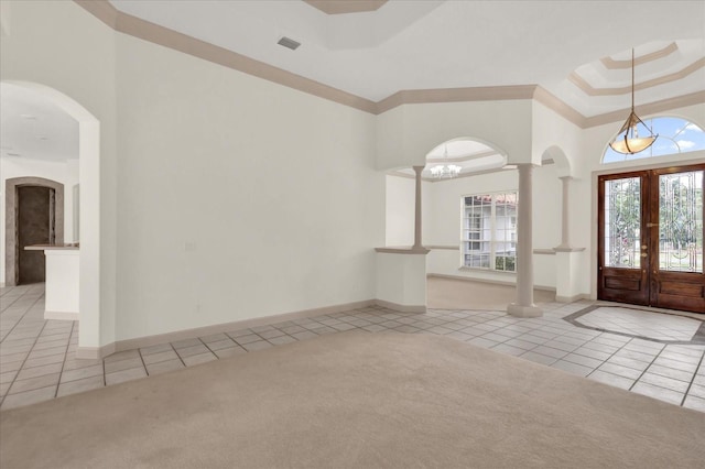 10616 Emerald Chase Dr, Orlando, FL 32836 - entrance foyer with light carpet, light tile patterned floors, visible vents, and a tray ceiling