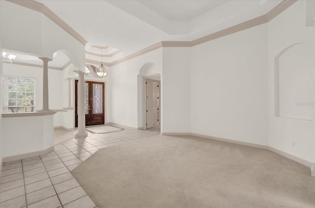 10616 Emerald Chase Dr, Orlando, FL 32836 - unfurnished room with light tile patterned flooring, baseboards, ornate columns, a raised ceiling, and crown molding