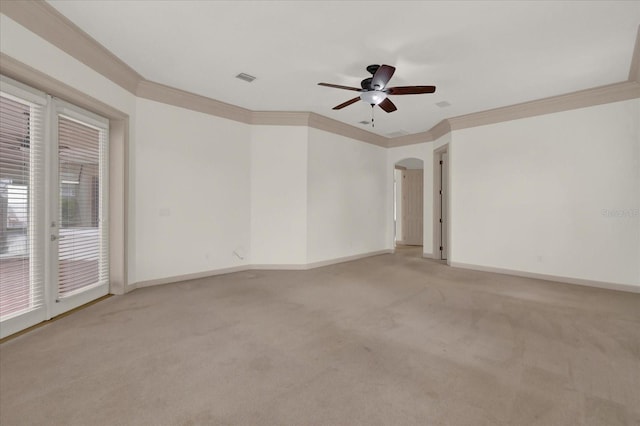 10616 Emerald Chase Dr, Orlando, FL 32836 - unfurnished room with arched walkways, light colored carpet, crown molding, and visible vents