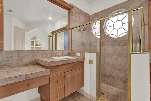 10616 Emerald Chase Dr, Orlando, FL 32836 - bathroom featuring a stall shower, visible vents, and vanity