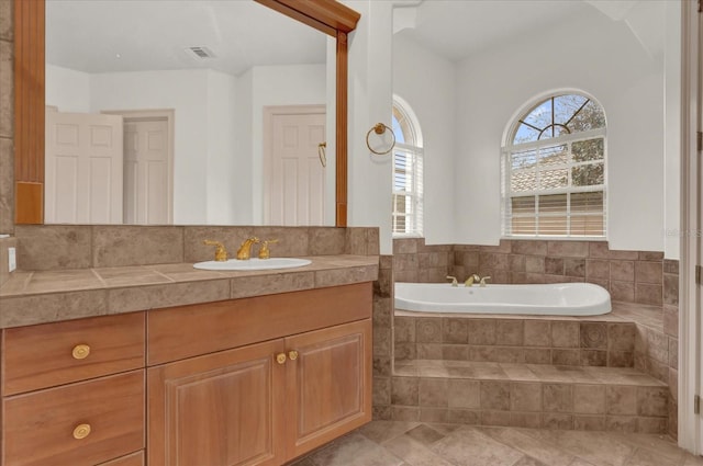 10616 Emerald Chase Dr, Orlando, FL 32836 - full bath with visible vents, a garden tub, and vanity