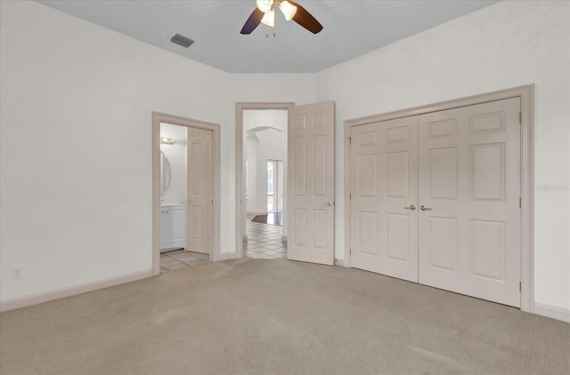 10616 Emerald Chase Dr, Orlando, FL 32836 - unfurnished bedroom with a closet, light colored carpet, visible vents, ceiling fan, and baseboards