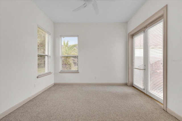 10616 Emerald Chase Dr, Orlando, FL 32836 - empty room featuring light carpet, ceiling fan, and baseboards
