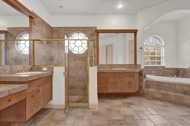 10616 Emerald Chase Dr, Orlando, FL 32836 - bathroom with two vanities, a sink, and a shower stall