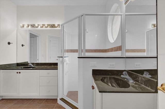 10616 Emerald Chase Dr, Orlando, FL 32836 - full bath with a stall shower, two vanities, a sink, and tile patterned floors