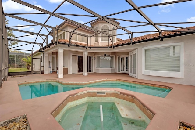10616 Emerald Chase Dr, Orlando, FL 32836 - exterior space featuring ceiling fan, an in ground hot tub, a lanai, and a tiled roof