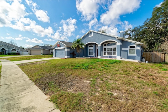 view of front of house featuring an attached garage, fence, concrete driveway, stucco siding, and a chimney