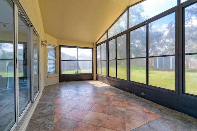 unfurnished sunroom with vaulted ceiling