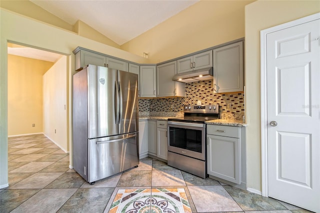 kitchen featuring lofted ceiling, stainless steel appliances, gray cabinetry, and under cabinet range hood