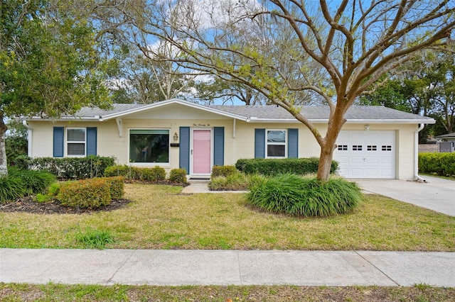 single story home featuring a front lawn, driveway, and an attached garage