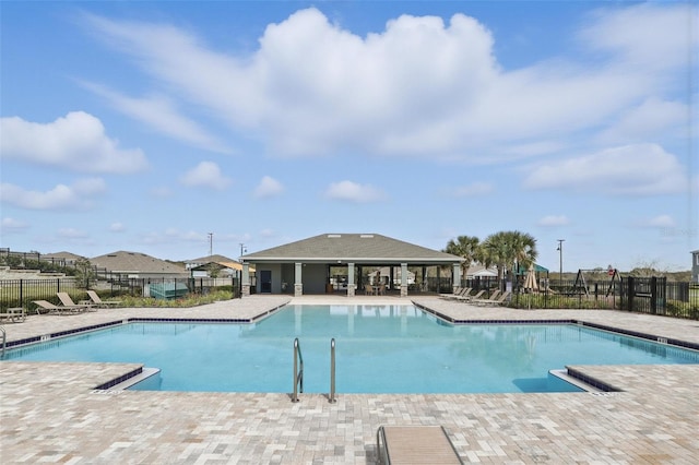 pool featuring a patio and fence