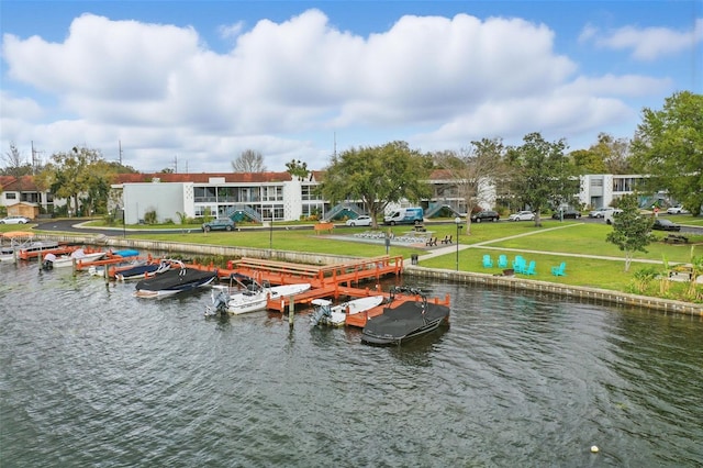 dock area featuring a yard and a water view