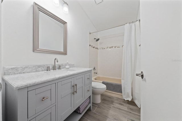 full bathroom featuring toilet, shower / bath combo, vanity, and wood tiled floor