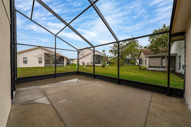 unfurnished sunroom featuring a residential view