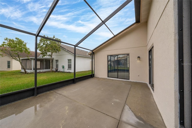 unfurnished sunroom featuring vaulted ceiling