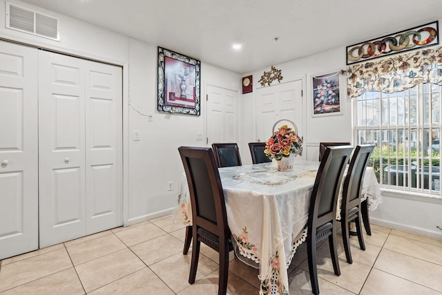 dining space featuring visible vents, baseboards, and light tile patterned floors