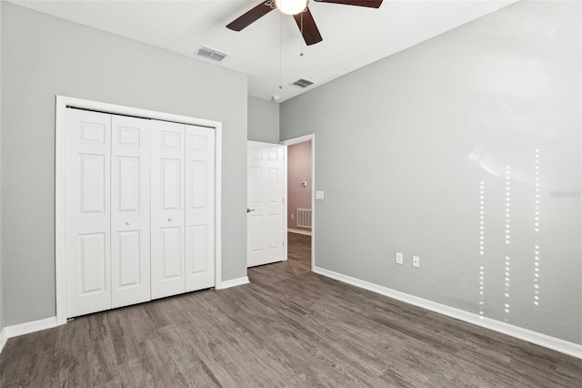 unfurnished bedroom featuring visible vents, baseboards, and wood finished floors