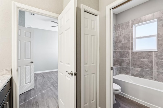 full bath with a closet, vanity, toilet, and wood finished floors