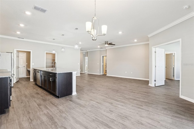 411 Lily Ln, Davenport, FL 33837 - kitchen with ceiling fan, recessed lighting, crown molding, a chandelier, and light wood-type flooring