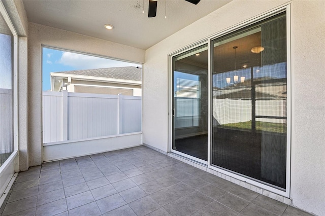 411 Lily Ln, Davenport, FL 33837 - unfurnished sunroom featuring a ceiling fan