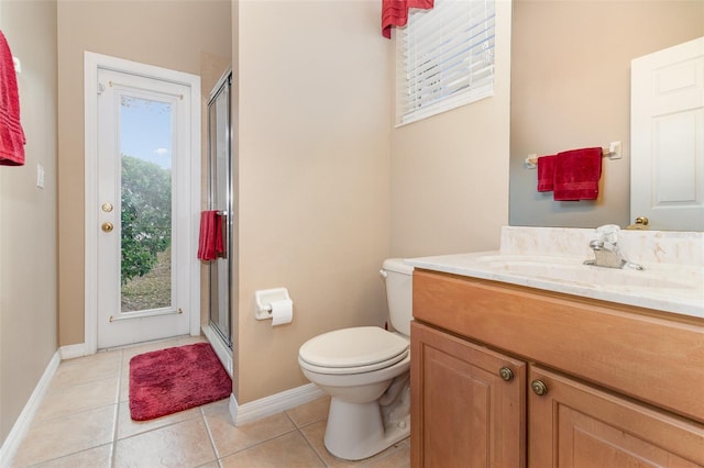 full bath featuring vanity, a shower stall, toilet, and tile patterned floors