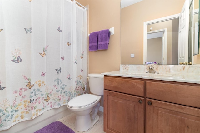 bathroom featuring tile patterned flooring, shower / tub combo with curtain, vanity, and toilet