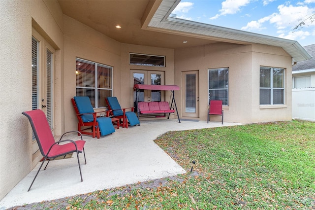 view of patio featuring french doors