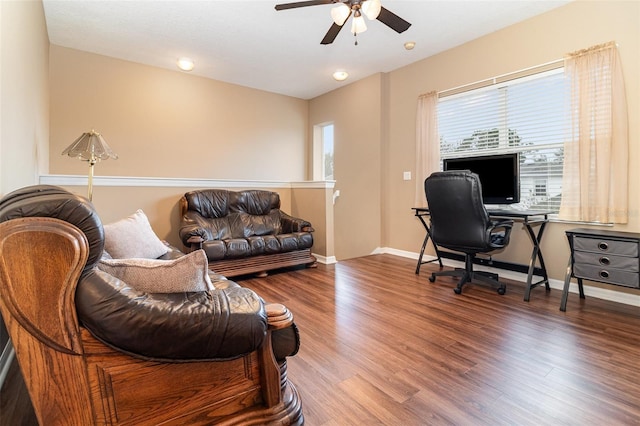 home office featuring a ceiling fan, baseboards, and wood finished floors