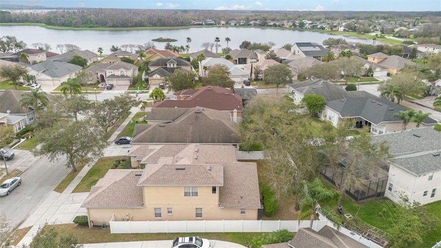 birds eye view of property featuring a water view and a residential view