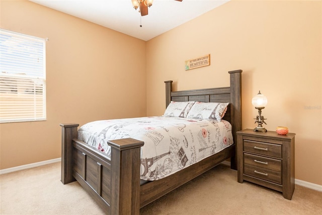 bedroom featuring carpet floors, baseboards, and a ceiling fan