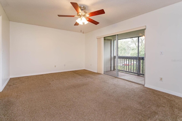 carpeted empty room featuring a ceiling fan, a textured ceiling, and baseboards