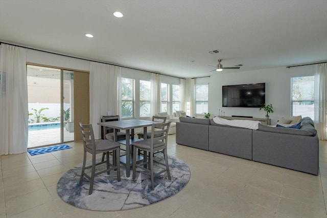 dining area with a wealth of natural light, recessed lighting, and light tile patterned floors