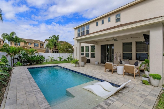 view of swimming pool with a patio area, ceiling fan, an outdoor living space, and a fenced backyard