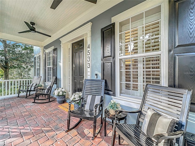 view of patio featuring covered porch and ceiling fan