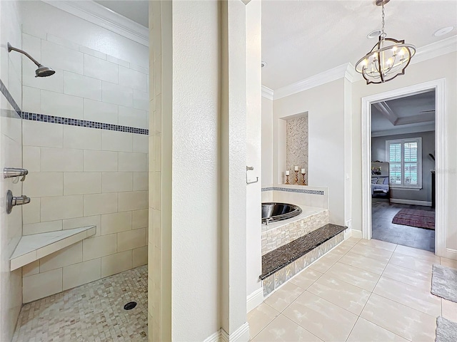 full bathroom with tile patterned floors, ornamental molding, tiled shower, baseboards, and a bath