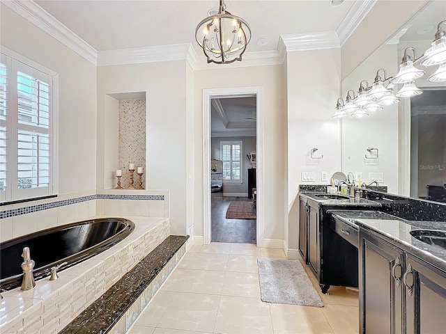 bathroom featuring a garden tub, ornamental molding, vanity, a chandelier, and tile patterned flooring