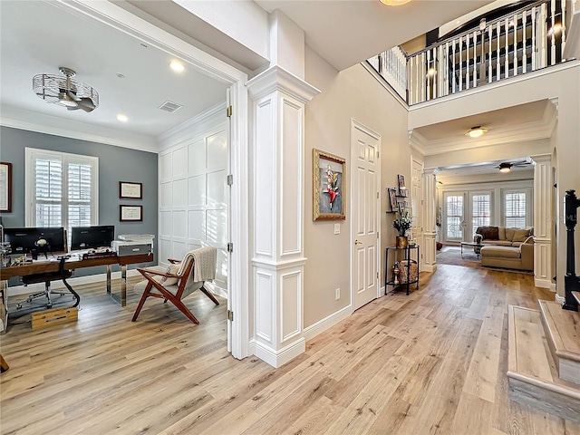 home office with french doors, light wood-style floors, visible vents, and ornate columns