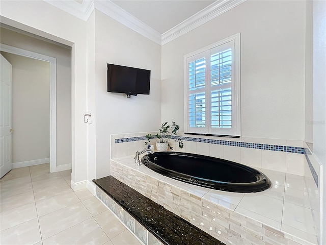 full bath with baseboards, ornamental molding, a bath, and tile patterned floors