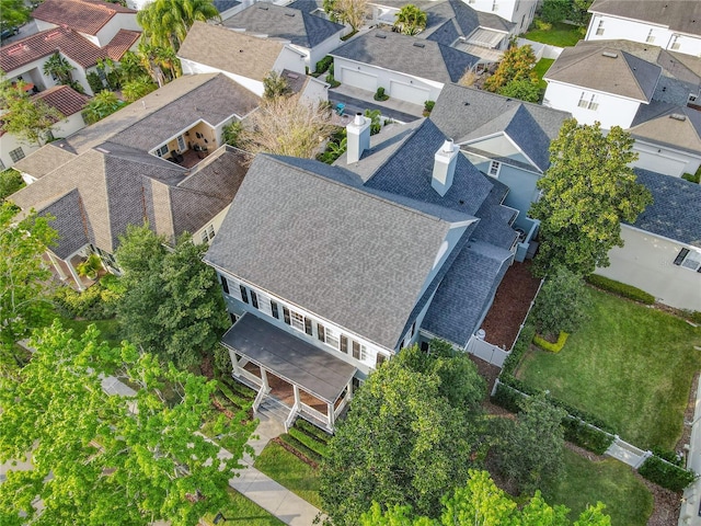 birds eye view of property with a residential view