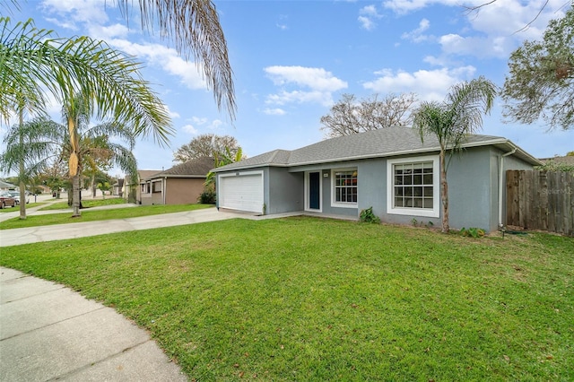 single story home with concrete driveway, an attached garage, fence, a front lawn, and stucco siding