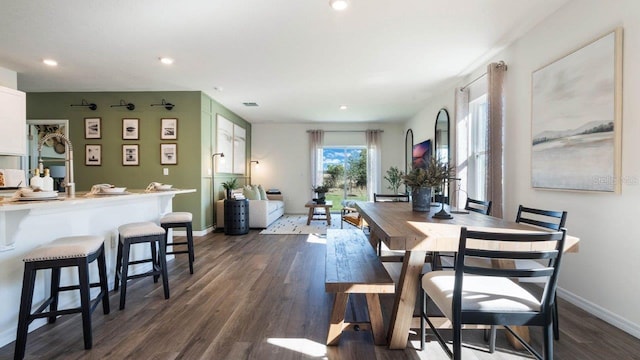 dining area with recessed lighting, dark wood-style flooring, and baseboards