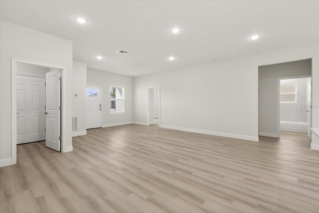 unfurnished living room with baseboards, recessed lighting, visible vents, and light wood-style floors