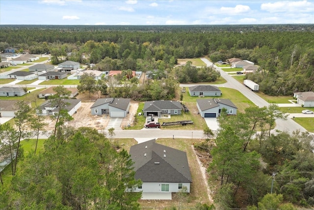 bird's eye view with a forest view and a residential view