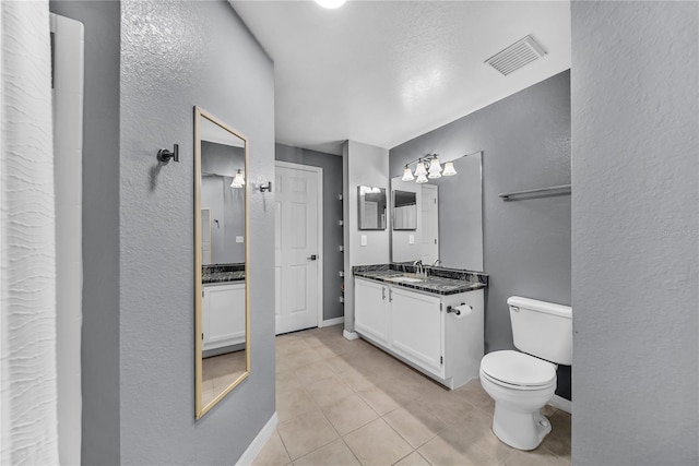 full bath featuring tile patterned flooring, vanity, visible vents, and baseboards